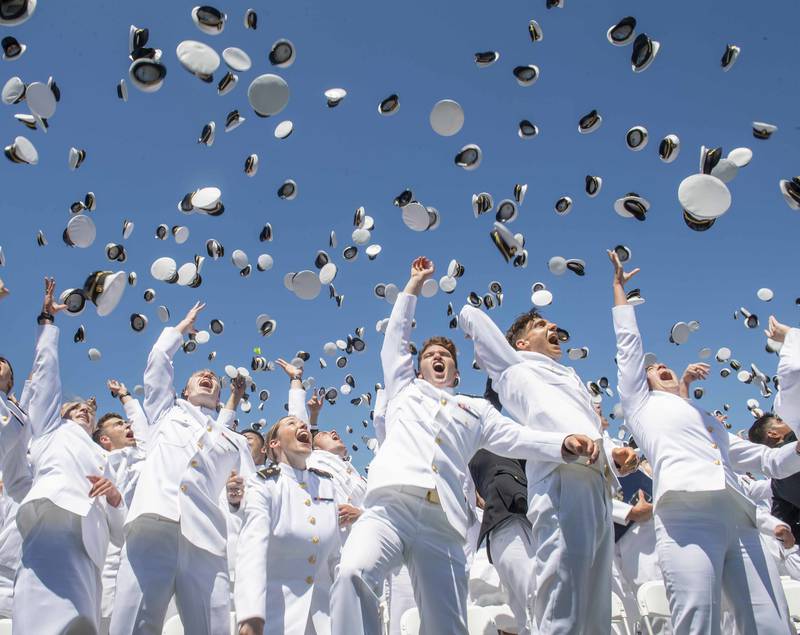 Midshipmen toss their covers in the air during the United States Naval Academy's Class of 2019 Graduation Day and Commissioning Ceremony