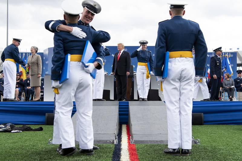 President Donald Trump congratulates cadets at the U.S. Air Force Academy graduation at Falcon Stadium in Colorado Springs, Colo.