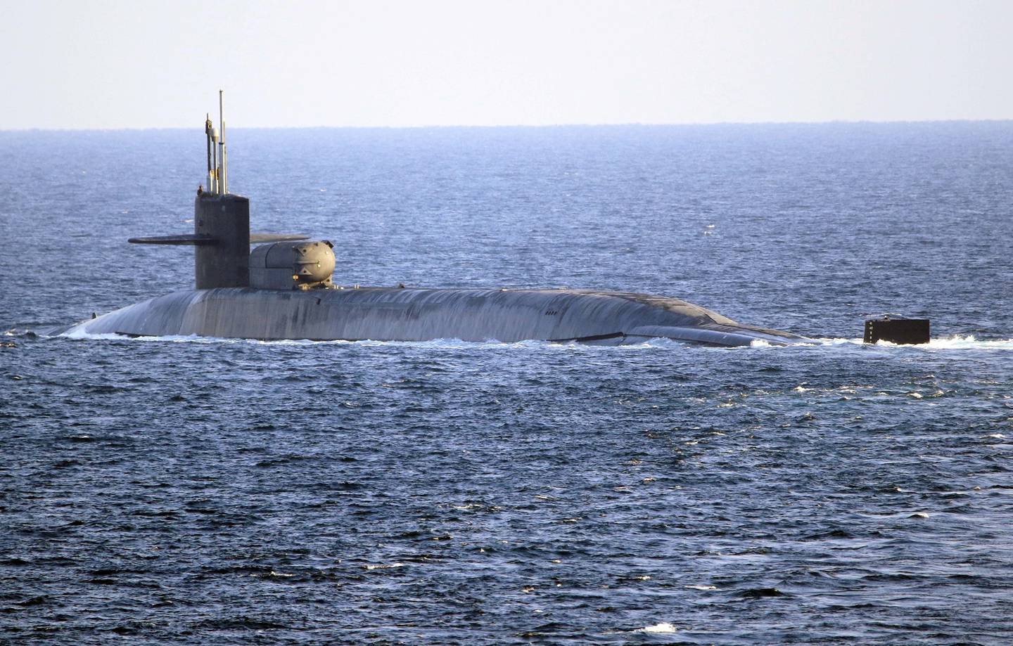The guided-missile submarine USS Georgia transits the Strait of Hormuz on Monday, Dec. 21, 2020.