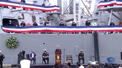 Cmdr. Edward Pledger, commanding officer of the destroyer Cole, delivers remarks during the 20th anniversary of the 2000 terrorist attack on the ship. (Photo: DOD video screen shot)