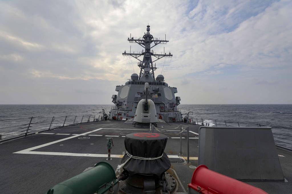 In this photo provided by U.S. Navy, The guided-missile destroyer Higgins conducts a routine Taiwan Strait transit Sept. 20, 2022.