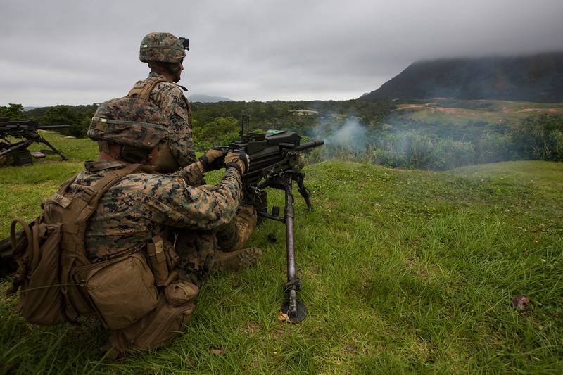 Marines fire a Mark 19 automatic grenade launcher during training at Camp Schwab, Okinawa