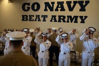 Plebes with the Class of 2023 don their covers at Induction Day on June 27, 2019, at the U.S. Naval Academy in Annapolis, Md.