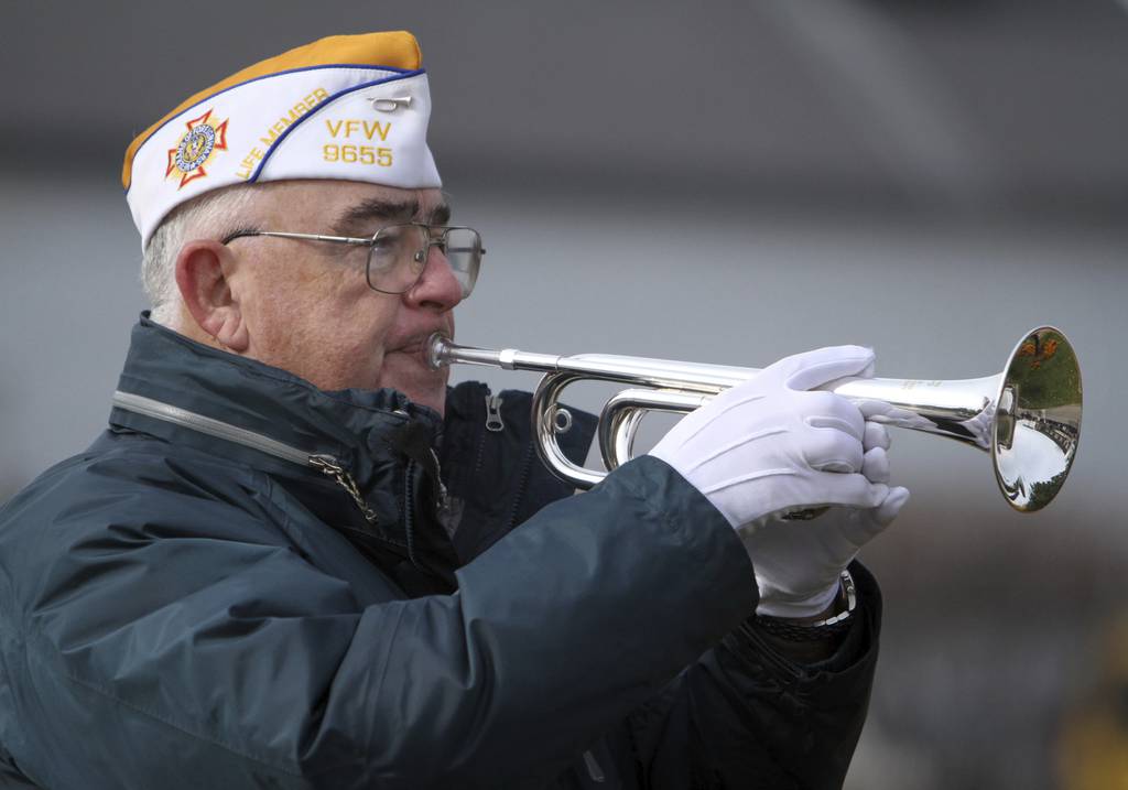 Jim Reynolds with Fox Lake VFW Post 9655 plays the bugle at the Veterans Day ceremony in Fox Lake on Nov. 11, 2011.
