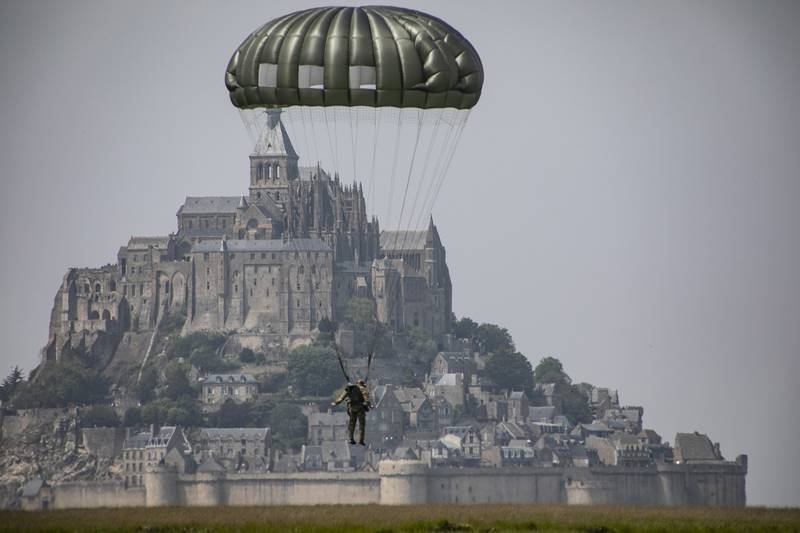 A paratrooper conducst an airborne operation near the island of Mont Saint Michel, Avranches, France.