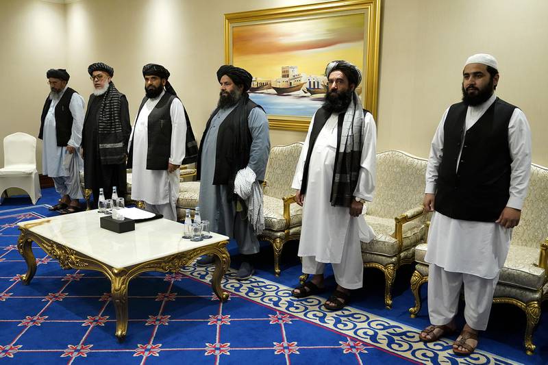Members of the Taliban's peace negotiation team meet with Secretary of State Mike Pompeo amid talks between the Taliban and the Afghan government, Saturday, Nov. 21, 2020, in Doha, Qatar.