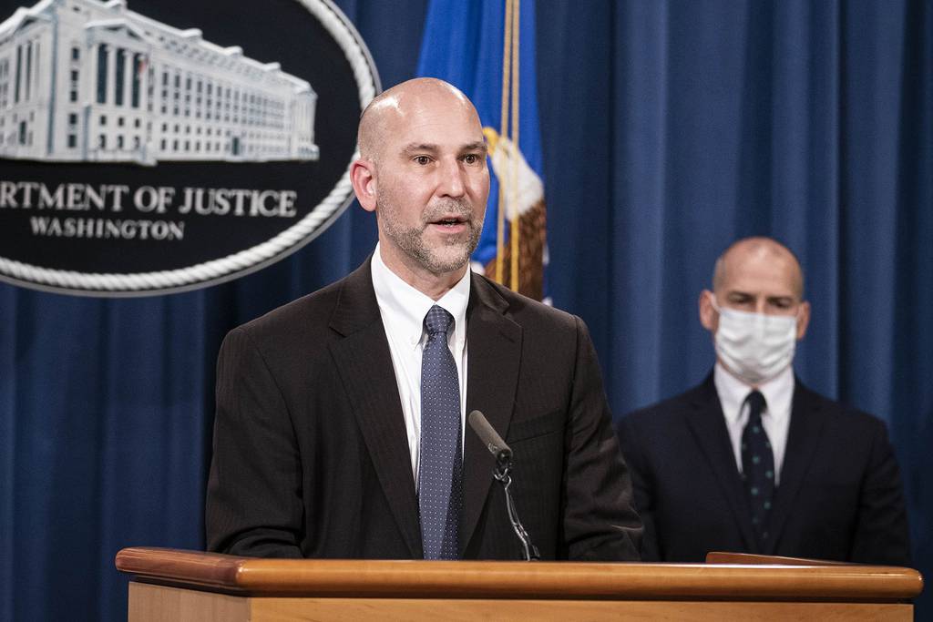 Steven D'Antuono, head of the FBI Washington field office, speaks as acting U.S. Attorney Michael Sherwin, right, listens during a news conference Tuesday, Jan. 12, 2021, in Washington.