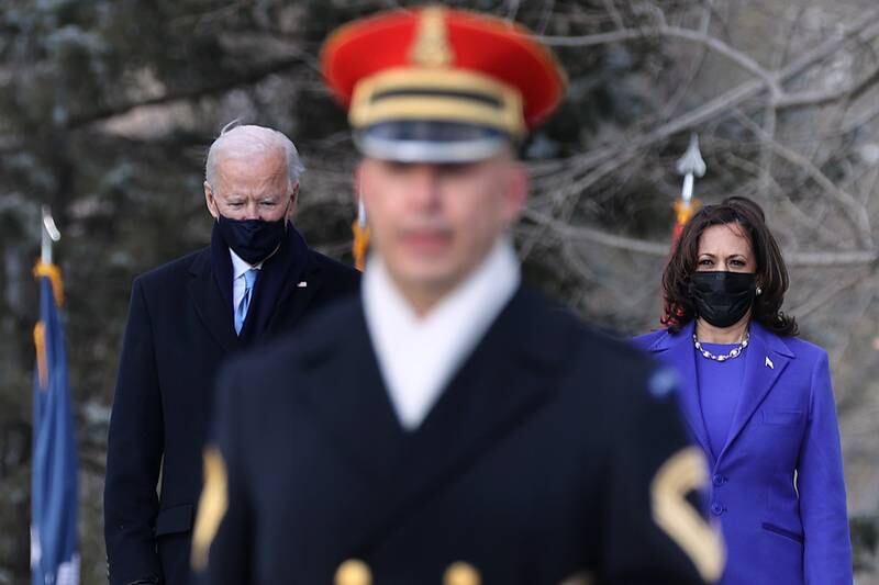 President Joe Biden and Vice President Kamala Harris attend a wreath-laying ceremony at Arlington National Cemetery's Tomb of the Unknown Soldier after the 59th Presidential Inauguration ceremony at the Capitol Jan. 20, 2021, in Arlington, Va.