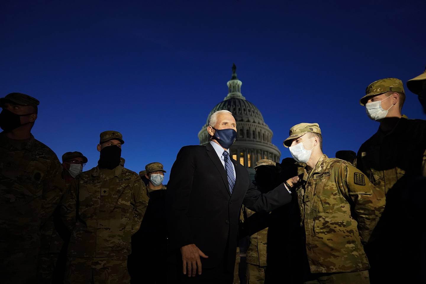 Vice President Mike Pence speaks to National Guard troops outside the U.S. Capitol, Thursday, Jan. 14, 2021, in Washington.