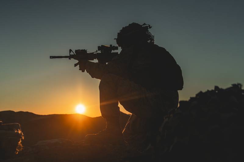 Hospitalman Keifer Ralph sets into a defensive position in support of the Battalion Distributed Operations Course during Service Level Training Exercise 1-21 at Marine Corps Air Ground Combat Center Twentynine Palms, Calif., Oct. 28, 2020.