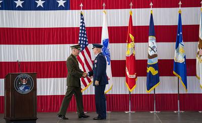 Joint Chiefs of Staff Gen. Joseph F. Dunford Jr., left, shakes hands with Gen. John W. Raymond, the commander of the U.S. Space Command
