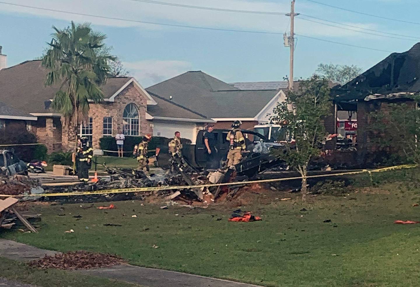 This photo provided by Greg Crippen shows the scene where a U.S. Navy training plane crashed in an Alabama residential neighborhood near the Gulf Coast, Friday, Oct. 23, 2020 near Foley, Ala.