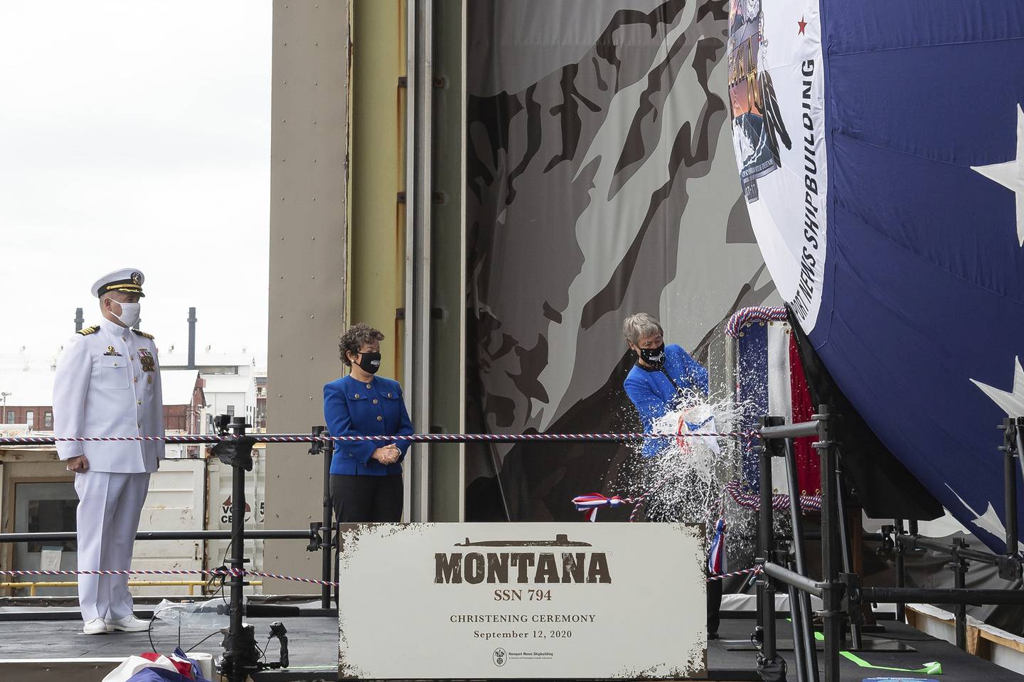 Former Secretary of the Interior Sally Jewell, right, christens the Virginia-class submarine USS Montana, also known as SSN 794, as the ship's commanding officer Capt. Michael Delaney, left, and Newport News Shipbuilding President Jennifer Boykin, look on during its christening ceremony on Saturday, Sept. 12, 2020, in Newport News, Va.