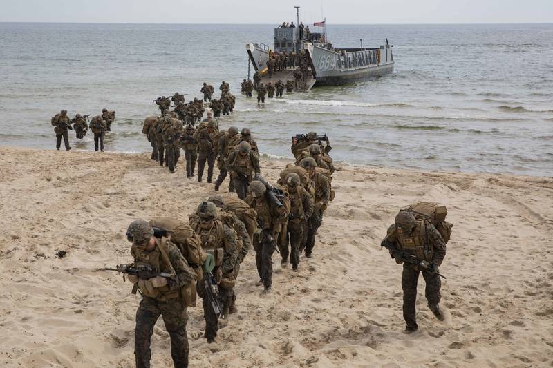 U.S. Marines disembark a landing craft, utility during a tactics exercise in Sweden for Baltic Operations (BALTOPS), June 10, 2019.