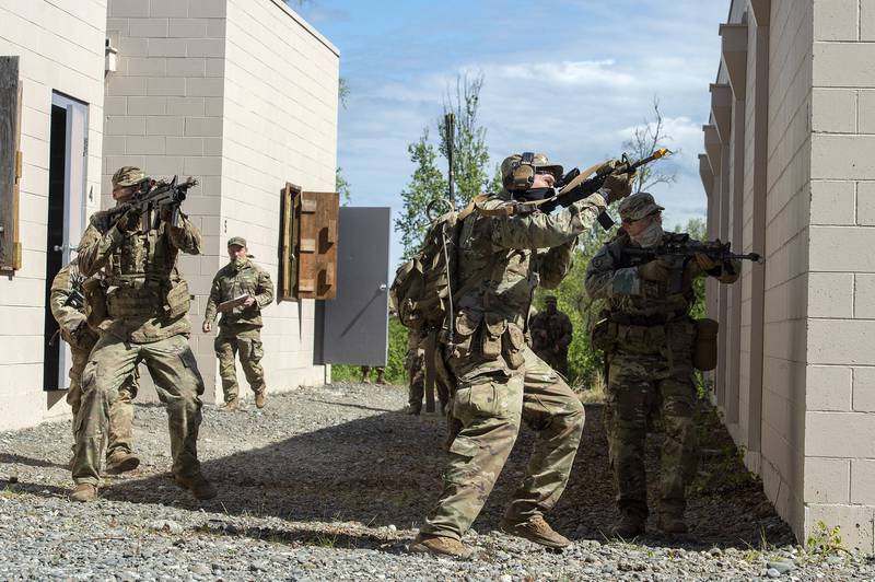 Paratroopers react to simulated enemy contact while clearing buildings May 20, 2020, during squad training at Joint Base Elmendorf-Richardson, Alaska.