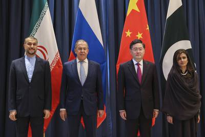 In this handout photo released by Russian Foreign Ministry Press Service, from left: Iranian Foreign Minister Hossein Amir-Abdollahian, Russian Foreign Minister Sergey Lavrov, Chinese Foreign Minister Qin Gang and Pakistani Minister of State for Foreign Affairs Hina Rabbani Khar pose for a group photo during a ministerial meeting in Samarkand, Uzbekistan, Thursday, April 13, 2023.