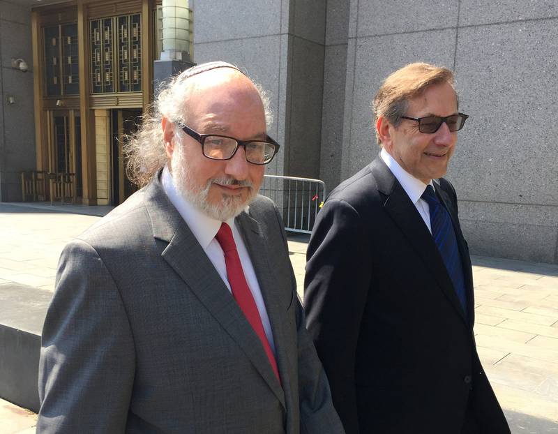 In this July 22, 2016, file photo, convicted spy Jonathan Pollard, left, with his lawyer, Eliot Lauer, leaves federal court in New York following a hearing.