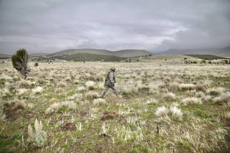 A soldier walks from one point to another during a land navigation course at Camp Williams, Utah, April 15, 2021.