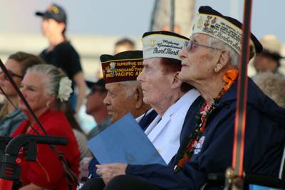 Pearl Harbor survivors and other military veterans observe a ceremony on Wednesday, Dec . 7, 2022 in Pearl Harbor, Hawaii in remembrance of those killed in the 1941 attack.