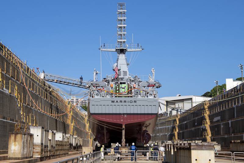 Ship repair facility personnel prepare to refloat the Avenger-class mine countermeasure ship USS Warrior (MCM 10) on June 10, 2020, in Sasebo, Japan.