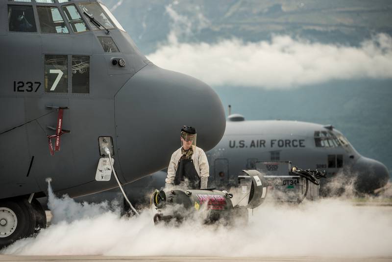 Senior Airman Sawyer Ezzell services the liquid oxygen system of a Kentucky Air National Guard C-130 Hercules aircraft at Aviano Air Base, Italy