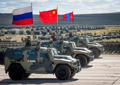 Russian, Chinese and Mongolian troops and military equipment parade at the end of the day of the Vostok-2018 (East-2018) military drills at Tsugol training ground not far from the Chinese and Mongolian border in Siberia on Sept. 13, 2018.