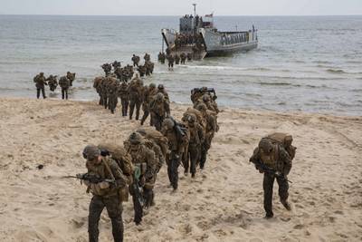 U.S. Marines disembark a landing craft, utility during a tactics exercise in Sweden for Baltic Operations (BALTOPS), June 10, 2019.