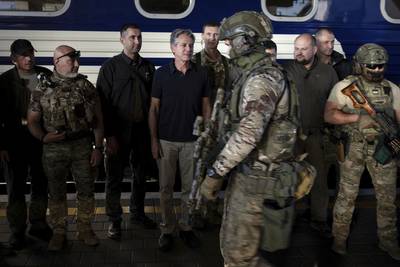U.S. Secretary of State Antony Blinken, center, stands next to Ukrainian security forces before departing a train station in Kyiv, Ukraine, on Thursday, Sept. 7, 2023.