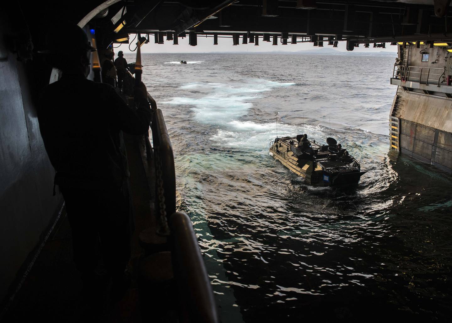 An assault amphibious vehicle assigned to the 31st Marine Expeditionary Unit enters the well deck of the amphibious assault ship Wasp on Jan. 14, 2019.