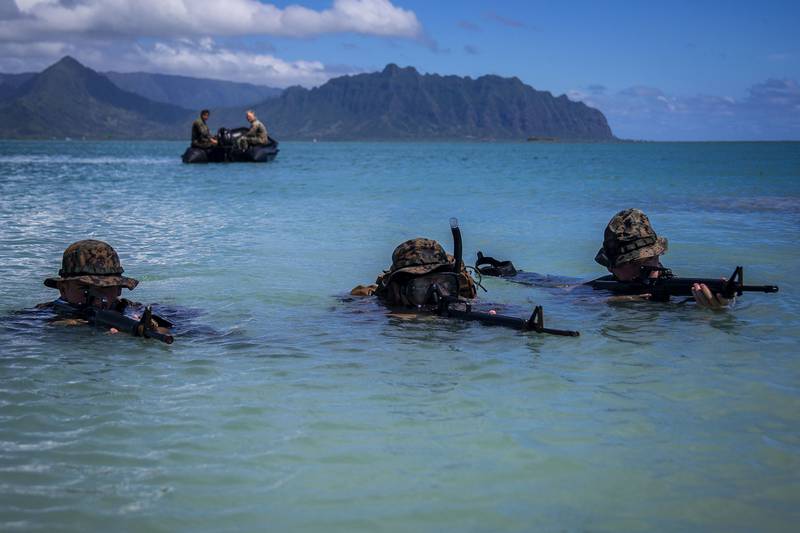 Marines scope out their terrain during an amphibious assault exercise at Marine Corps Base Hawaii, May 28, 2020.