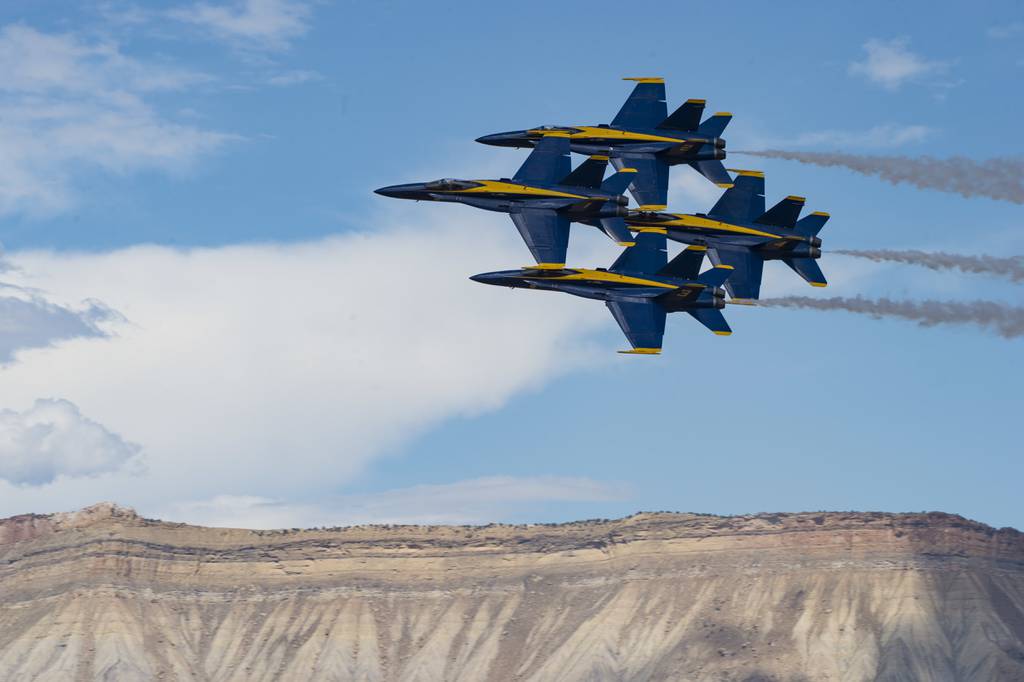 The U.S. Navy Flight Demonstration Squadron, the Blue Angels, diamond pilots perform the “Diamond 360” maneuver July 27, 2019, in a demonstration at the Grand Junction Air Show in Grand Junction, Colo.