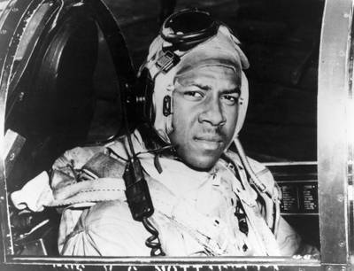 This circa 1950 photo provided by the U.S. Navy shows Jesse Brown in the cockpit of an F4U-4 Corsair fighter at an unidentified location.