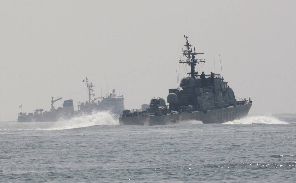 South Korean Navy's patrol ships search for survivors from the sunken South Korean navy ship near South Korea's Baekryeong island, March 29, 2010.