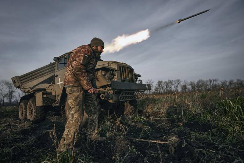 The Ukrainian military's Grad multiple-rocket launcher fires rockets at Russian positions in the frontline near Bakhmut, Donetsk region, Ukraine, Thursday, Nov. 24, 2022. (AP Photo/LIBKOS)