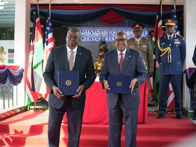 U.S. Secretary of Defense Lloyd J. Austin, left and Kenya Cabinet Secretary for Defense Aden Duale, hold copies of a signed bilateral defense cooperation agreement, in Nairobi, Kenya, Monday Sept. 25, 2023.