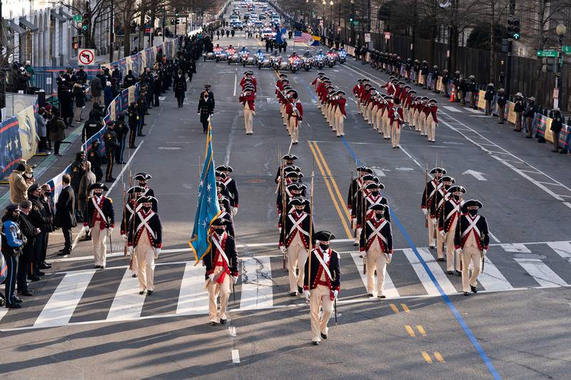 Members of the military march on 15th Street towards the White House during a presidential escort to the White House  following President Joe Biden taking the oath of office in Washington on Jan. 20, 2021.