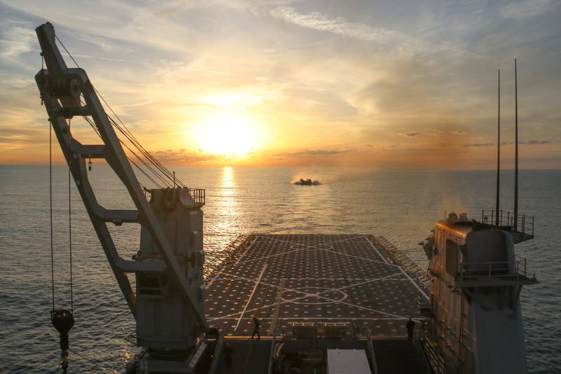 A landing craft air cushion approaches the well deck of the dock landing ship USS Carter Hall on Feb. 7, 2023