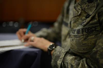 A service member takes notes during a focus group on Sept. 26, 2013.