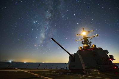 The Arleigh Burke class guided-missile destroyer USS Sterett (DDG 104) steams through the night in the Gulf of Oman on Sept. 17, 2020.