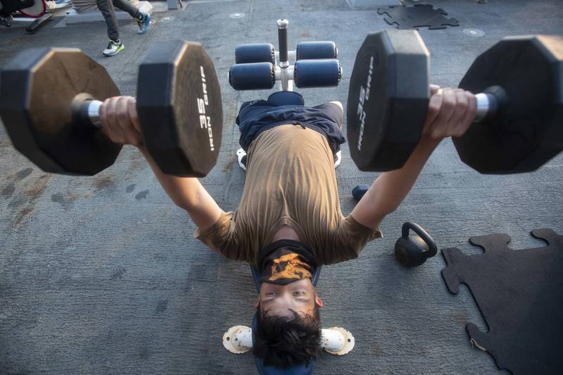 Boatswain's Mate Seaman Apprentice Esau Arellano, assigned to the Arleigh Burke-class guided-missile destroyer USS Ralph Johnson (DDG 114), engages in physical fitness while underway on Aug. 4, 2020, in the Arabian Gulf.