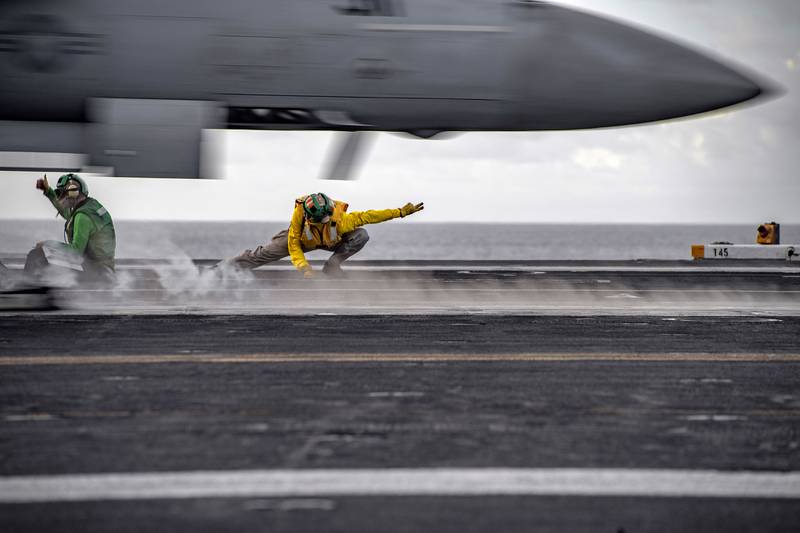 Sailors conduct flight operations aboard the aircraft carrier USS Nimitz (CVN 68) on June 28, 2020, in the Philippine Sea. The Nimitz and Ronald Reagan Carrier Strike Groups are conducting dual carrier operations in the Indo-Pacific as the Nimitz Carrier Strike Force.