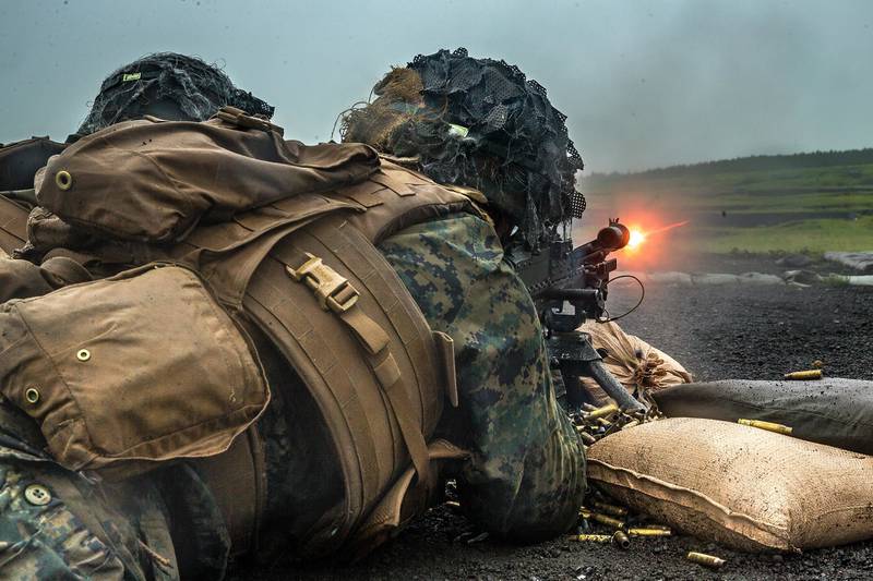 Marines with 1st Battalion, 6th Marine Regiment, currently assigned to 3rd Marine Division under the Unit Deployment Program, utilize an M240B during a mixed weapons range on Combined Arms Training Center Fuji, Japan, June 19, 2020.