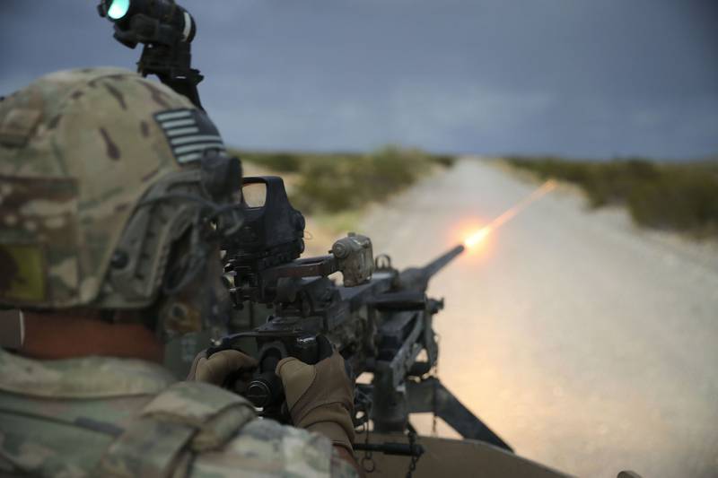 Capt. Matthew Sneddon, 3rd Brigade, 1st Armored Division, fires a vehicle-mounted M2 Browning machine gun on Aug.14, 2020, at Fort Bliss, Texas.