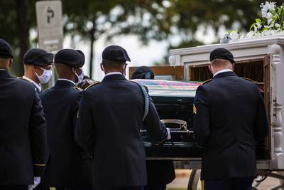 The casket of Army Spc. Vanessa Guillen is removed from a carriage to take it to a memorial service in honor of the soldier at Cesar Chavez High School Friday, Aug. 14, 2020, in Houston.