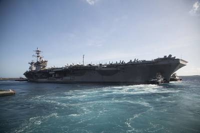 The aircraft carrier USS Theodore Roosevelt (CVN 71) departs Apra Harbor on May 21, 2020, following an extended visit to Guam in the midst of the COVID-19 global pandemic.