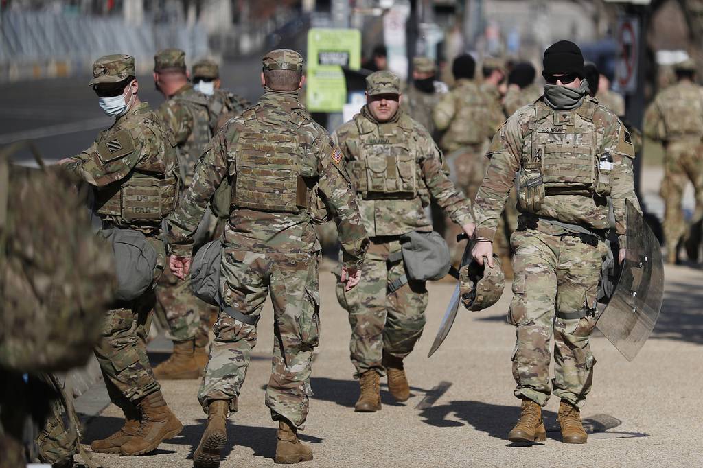 National Guard troops continue to be deployed around the Capitol one day after the inauguration of President Joe Biden, Thursday, Jan. 21, 2021, in Washington.