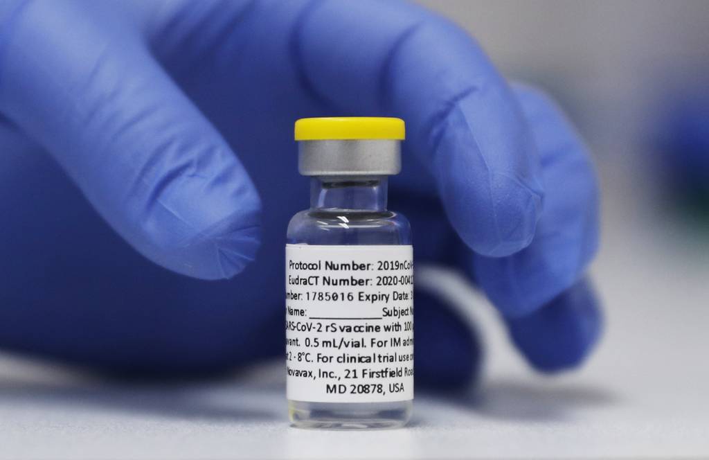 A vial of the Phase 3 Novavax coronavirus vaccine prepared for use in a trial at St. George's University hospital in London, Oct. 7, 2020. The Novavax COVID-19 vaccine that could soon win federal approval may offer a boost for the U.S. military: an opportunity to get shots into some of the thousands of service members who have refused the vaccine for religious reasons. (Alastair Grant/AP)