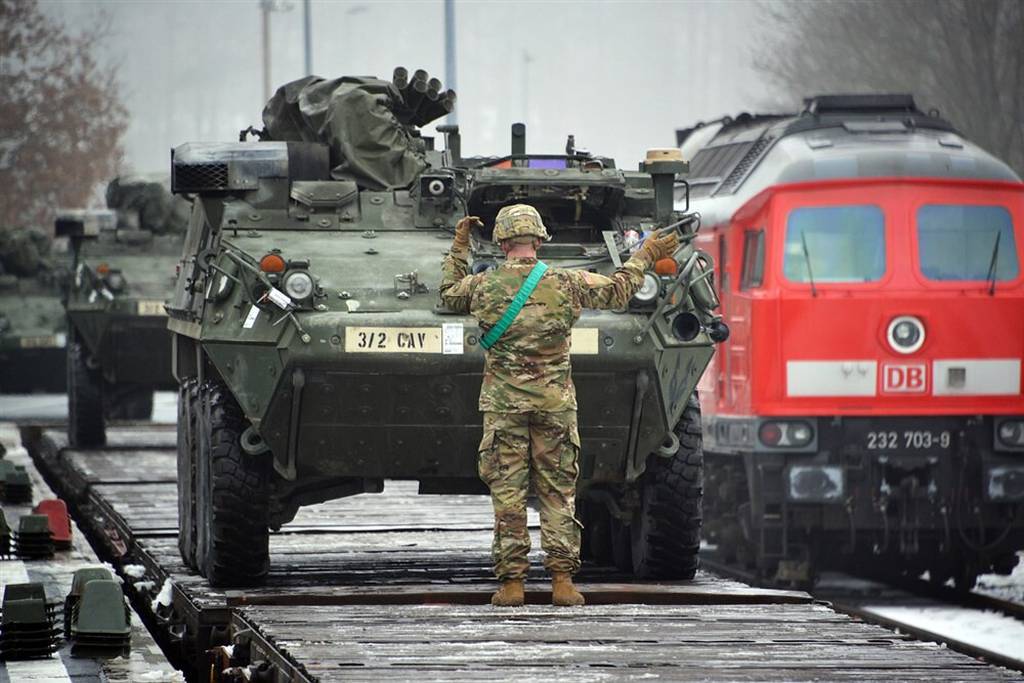 U.S. soldiers assigned to Lightning Troop, 3rd Squadron, 2nd Cavalry Regiment, load Stryker Fighting Vehicles on rail cars at Rose Barracks’ railhead station in Vilseck, Germany, in 2016.