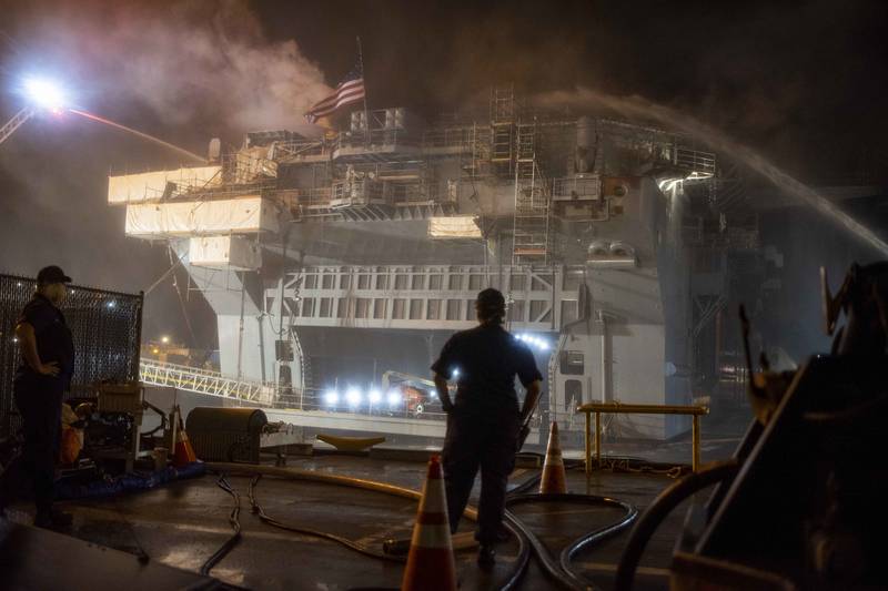 Sailors combat a fire aboard the amphibious assault ship Bonhomme Richard (LHD 6) on July 13 in San Diego.