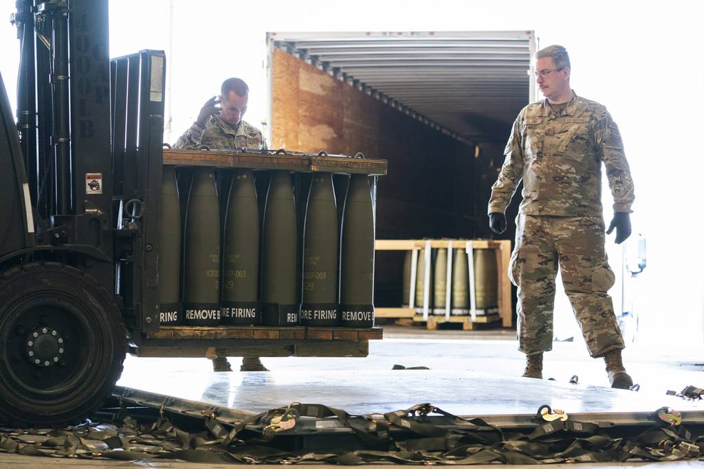 Airmen with the 436th Aerial Port Squadron place 155 mm shells on aircraft pallets ultimately bound for Ukraine, April 29, 2022, at Dover Air Force Base, Del.